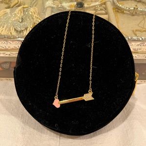 Jami gold colored arrow necklace with pink heart arrow